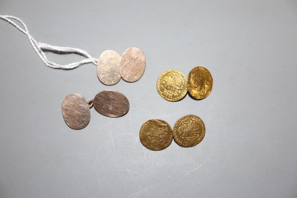 A pair of mounted George III one third guinea cufflinks, gross 10 grams and a pair of yellow metal cufflinks, 10.5 grams.